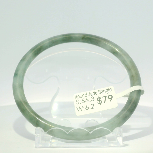 Natural Burmese jadeite bangle in two-tone vintage and imperial green, 64.3mm inner diameter