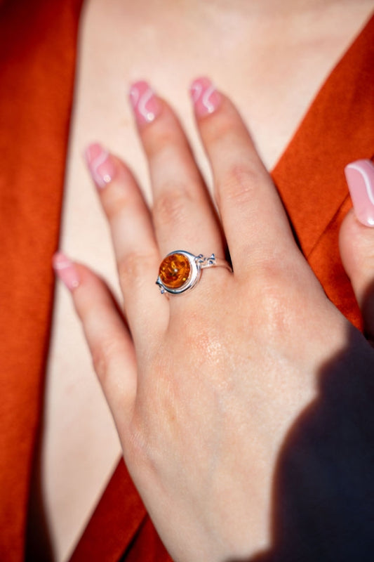 Amber ring on hand, natural resin gemstone with golden hue – Brother Ryan Shop