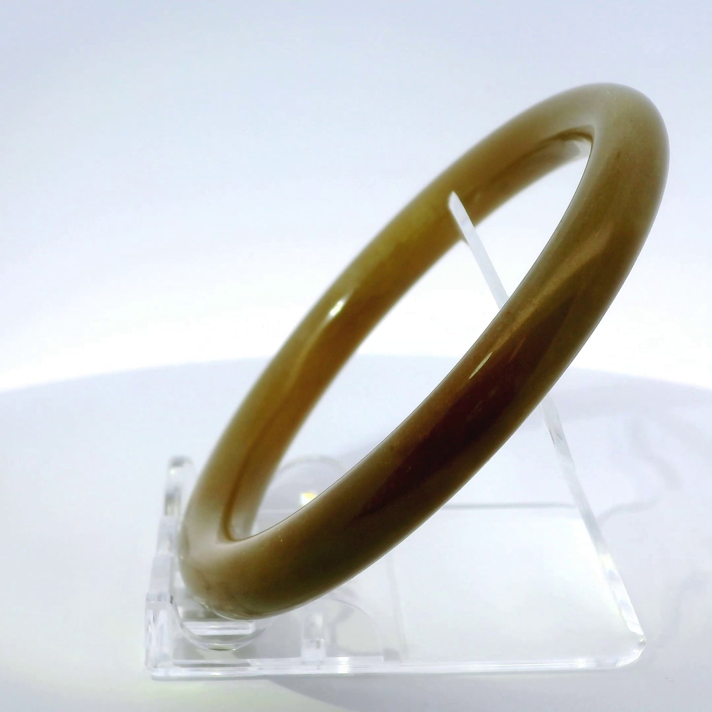 63mm Raw Honey Round jade bangle, angled side view on display stand, authentic Type A Burma jadeite, Brother Ryan Shop
