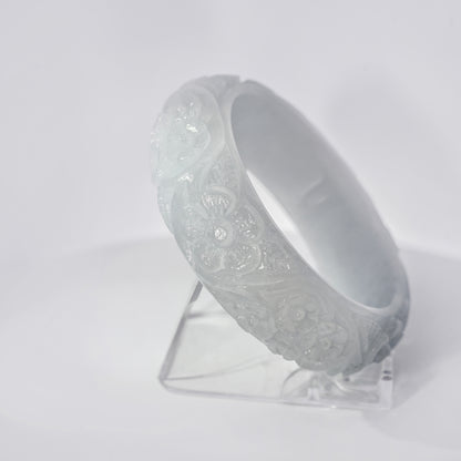 61mm White Flower Carved Jade Bangle, upright edge view on display stand, authentic Type A Burma jadeite, Brother Ryan Shop