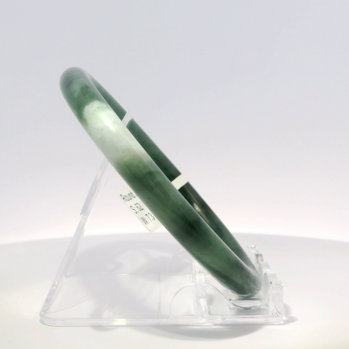 Natural Burmese Jadeite Bangle 62mm imperial white angled side view on stand - SL087