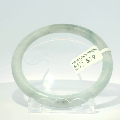 Natural Burmese jadeite bangle, white base with apple green tones, 64.2mm inner diameter