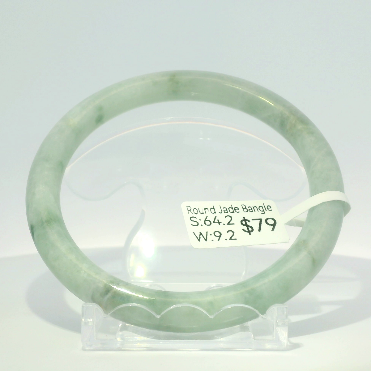 Two-tone natural Burmese jadeite bangle in white and apple green, 64.2mm inner diameter