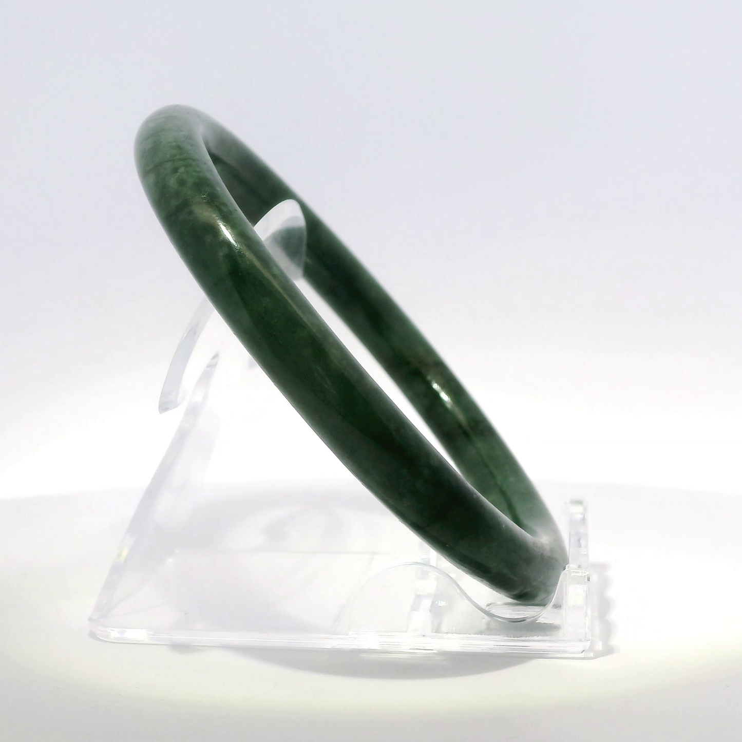 Natural Burmese Jadeite Bangle 61.3mm imperial black angled side view on stand - SL431