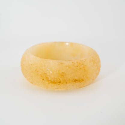 Floral-engraved light honey Burmese jadeite bangle cuff with differing front and back patterns