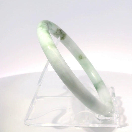 58mm Apple Mix Round Cut Bangle, upright edge view on display stand, authentic Type A Burma jadeite, Brother Ryan Shop