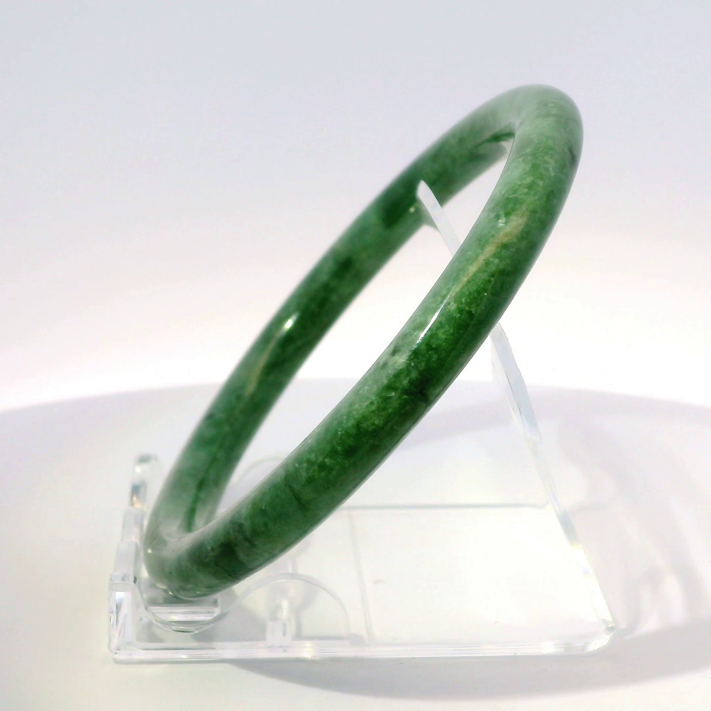 60mm Imperial Round Jade Bangle, angled side view on display stand, authentic Type A Burma jadeite, Brother Ryan Shop