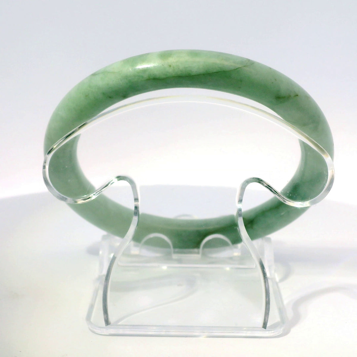 55mm Green Round Jade Bangle, upright edge view on display stand, authentic Type A Burma jadeite, Brother Ryan Shop