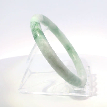 55mm Mossy Ocean Round Jade Bangle, upright edge view on display stand, authentic Type A Burma jadeite, Brother Ryan Shop