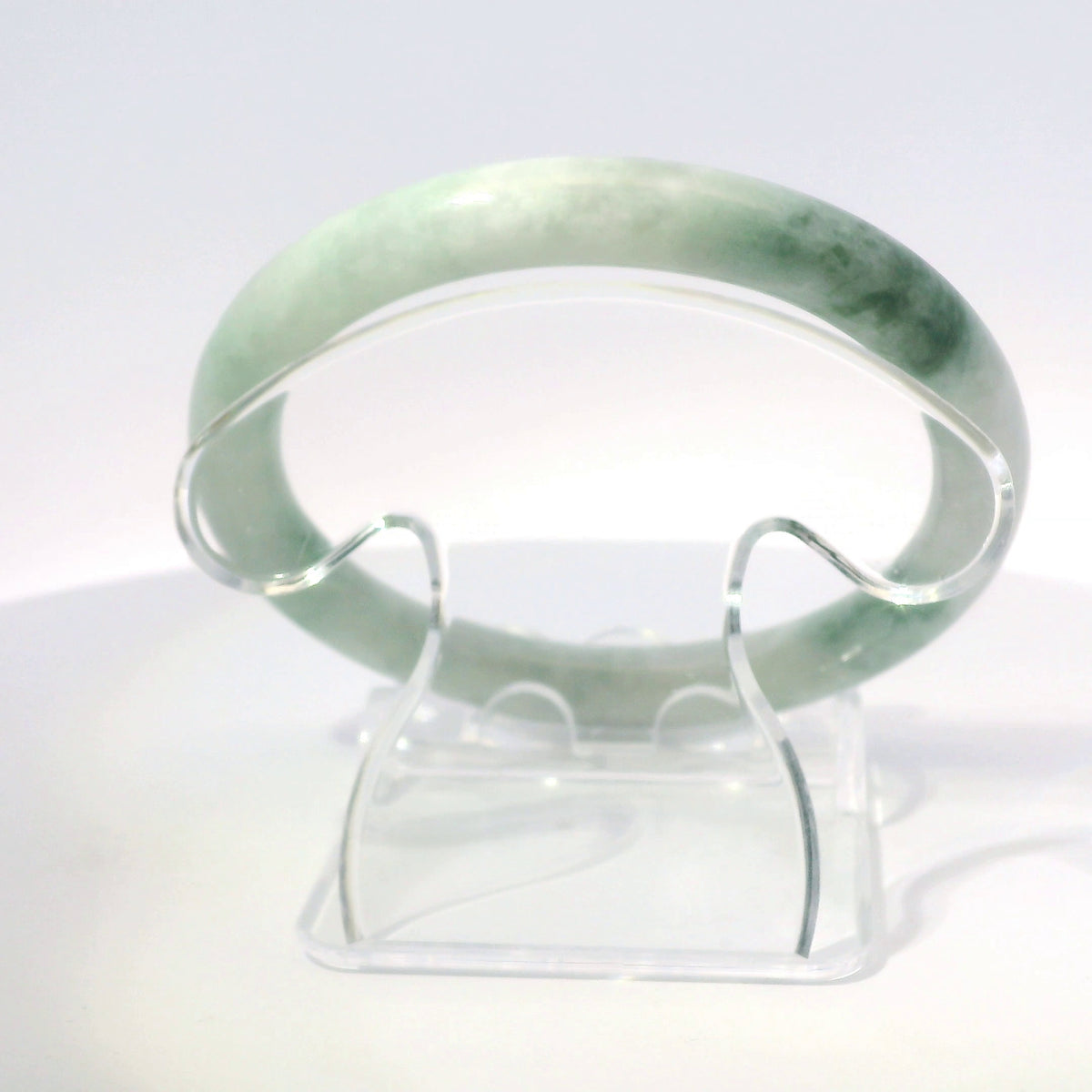 55mm Mossy Ocean Round Jade Bangle, top-down view on display stand, authentic Type A Burma jadeite, Brother Ryan Shop
