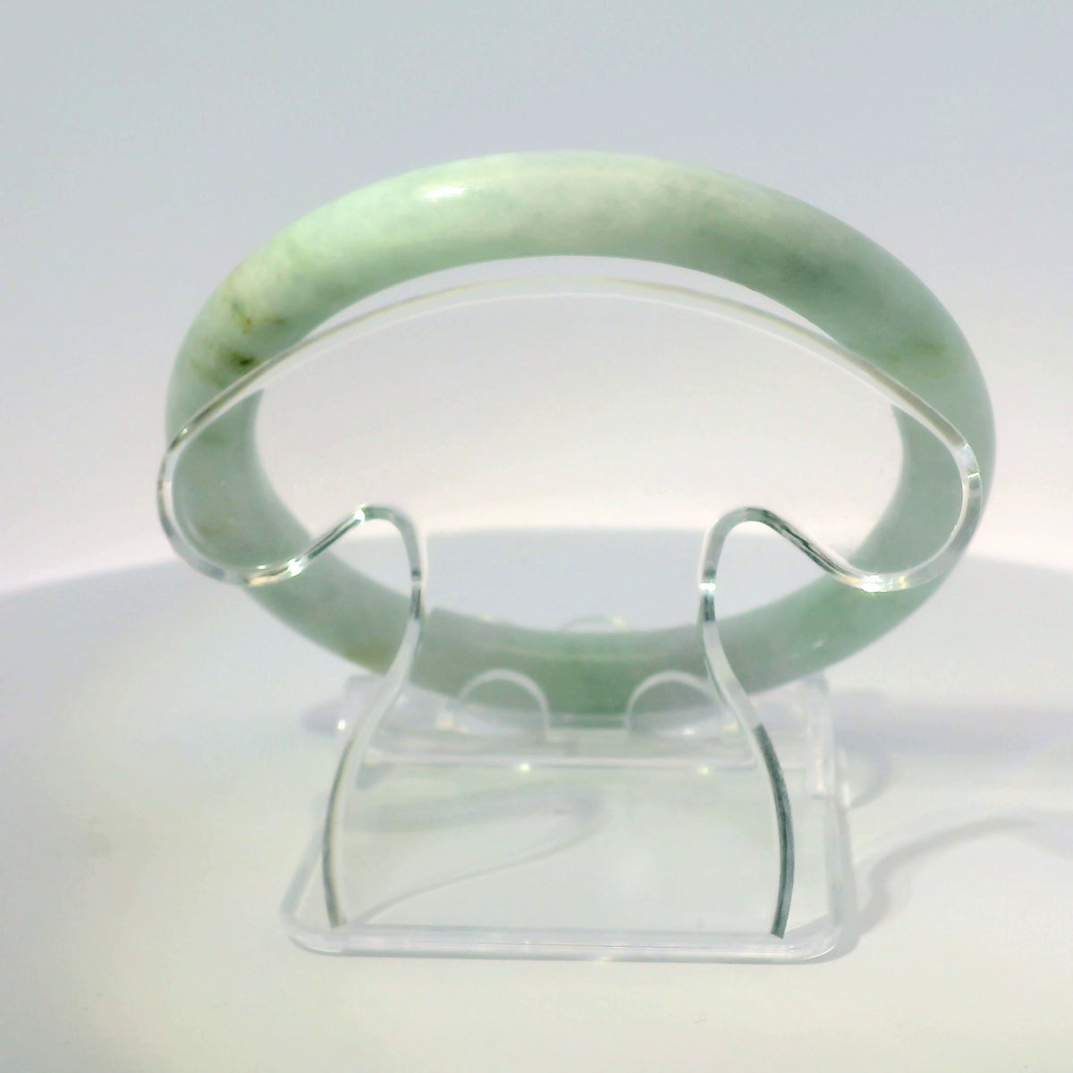 56mm Light Sakura Round Jade Bangle, top-down view on display stand, authentic Type A Burma jadeite, Brother Ryan Shop