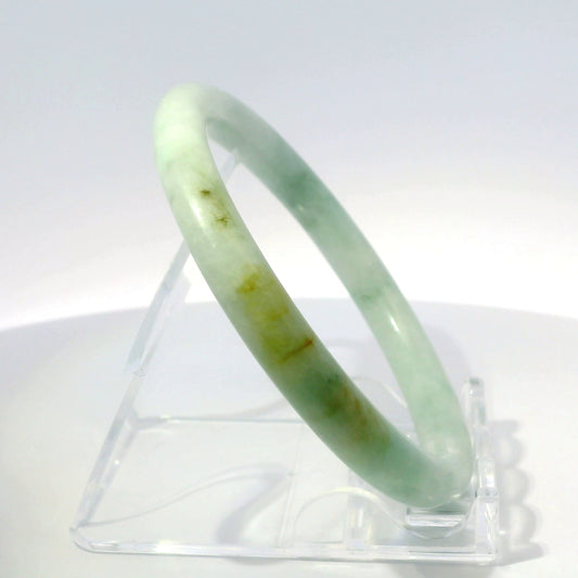 56mm Golden Mountain Round Jade Bangle, upright edge view on display stand, authentic Type A Burma jadeite, Brother Ryan Shop