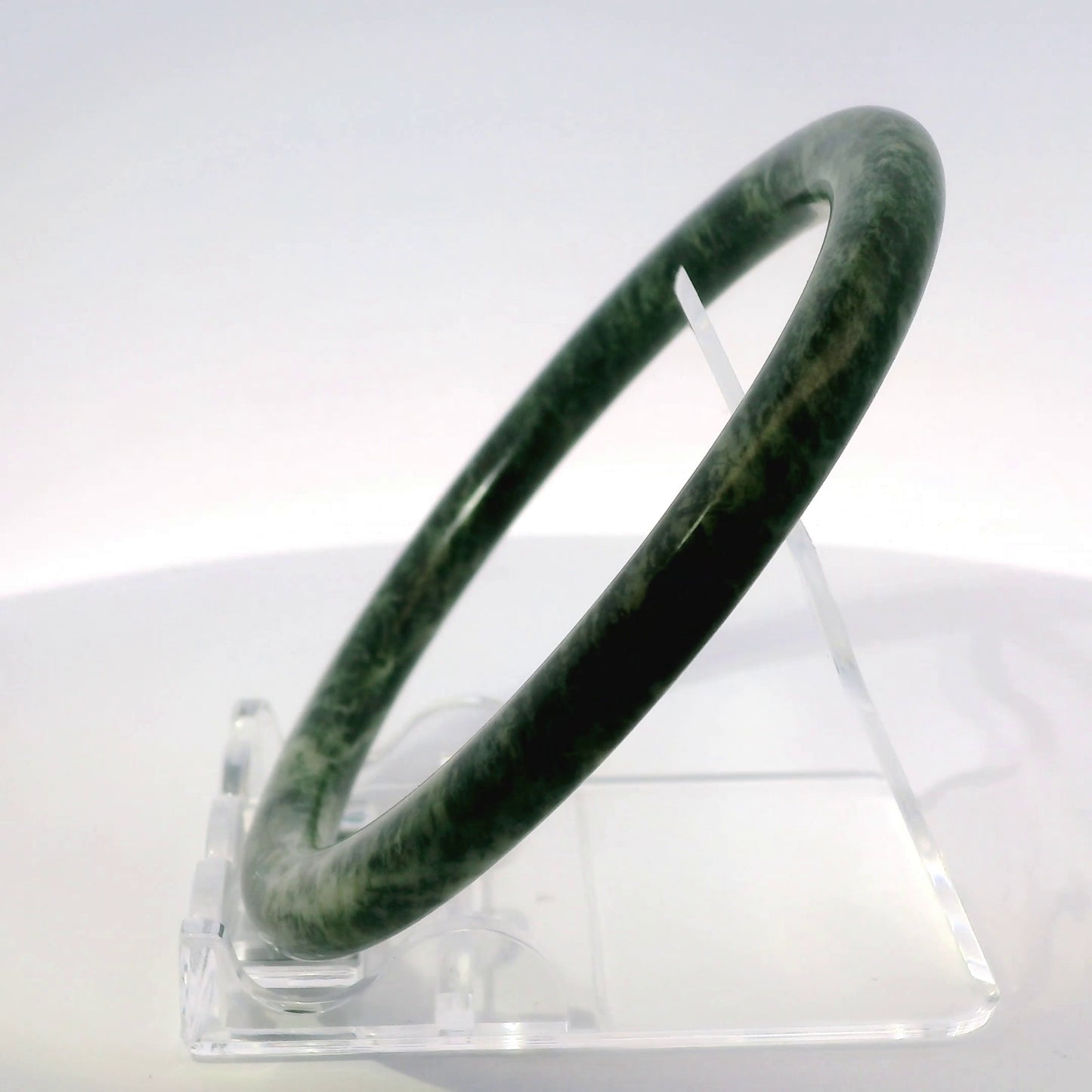 60mm Fiery Forest Round Jade Bangle, top-down view on display stand, authentic Type A Burma jadeite, Brother Ryan Shop