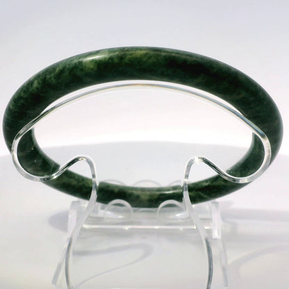 60mm Fiery Forest Round Jade Bangle, upright edge view on display stand, authentic Type A Burma jadeite, Brother Ryan Shop