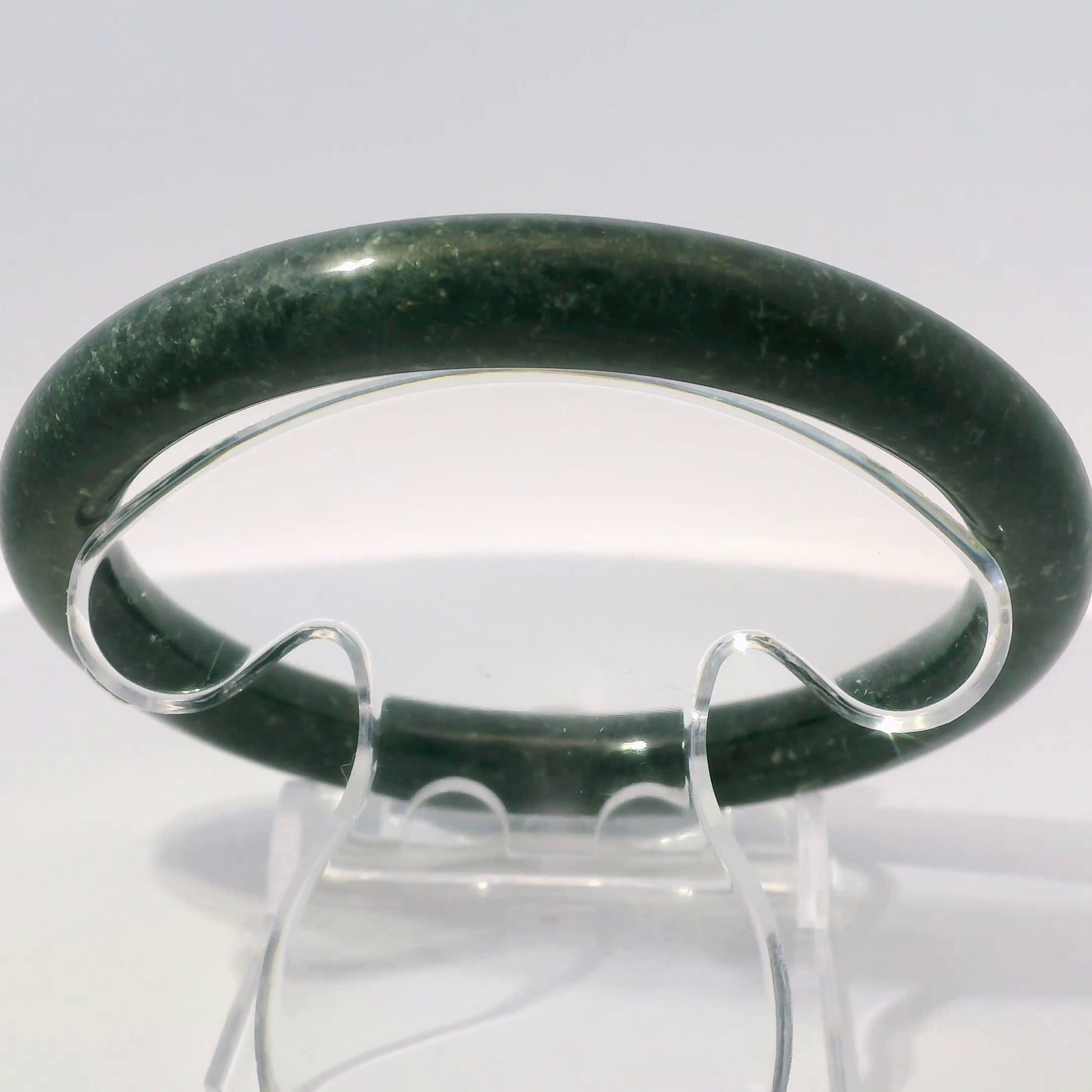 63mm Black Round Jade Bangle, upright edge view on display stand, authentic Type A Burma jadeite, Brother Ryan Shop