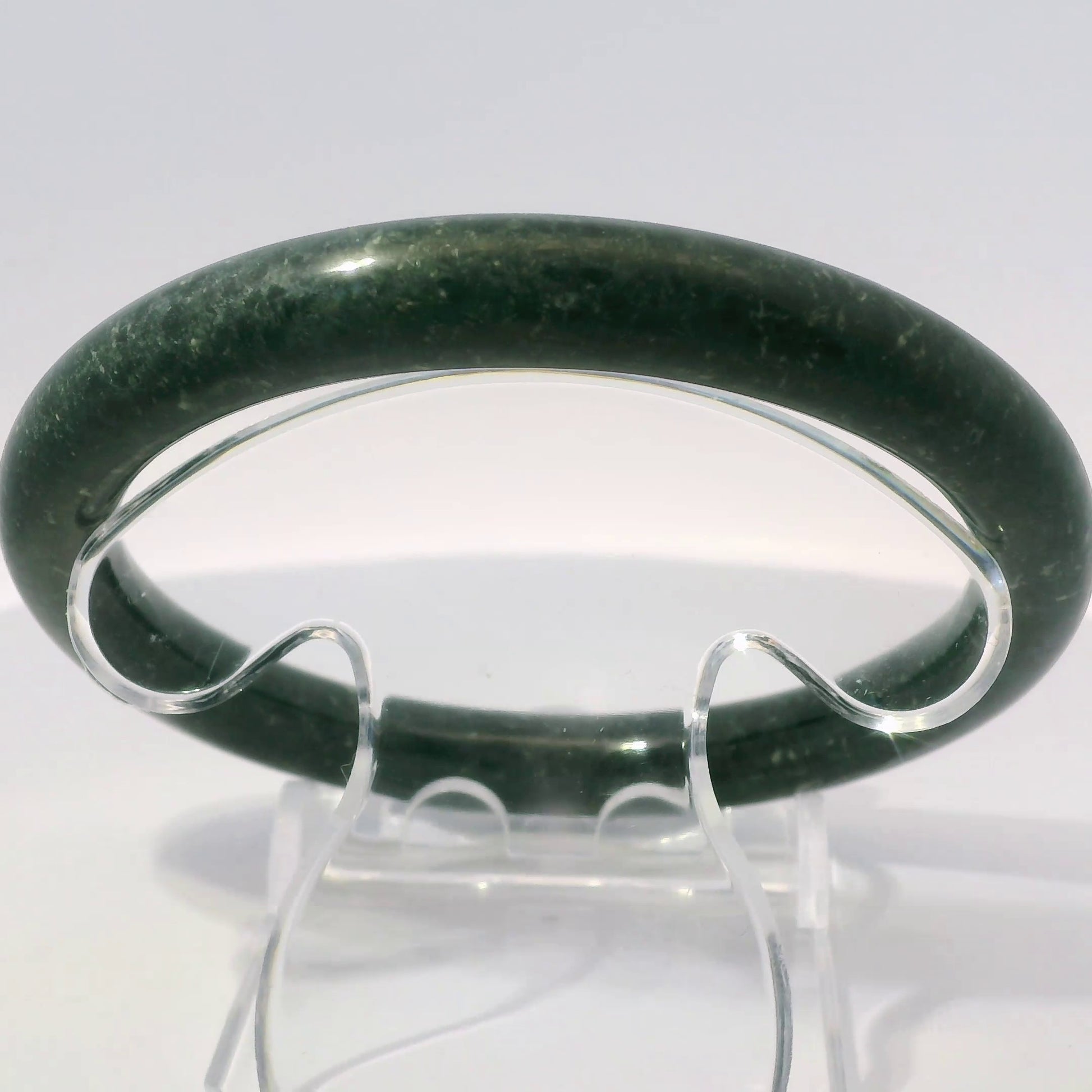 63mm Black Round Jade Bangle, upright edge view on display stand, authentic Type A Burma jadeite, Brother Ryan Shop