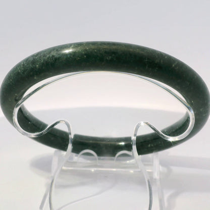 63mm Black Round Jade Bangle, upright edge view on display stand, authentic Type A Burma jadeite, Brother Ryan Shop