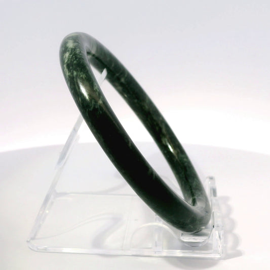56.8mm Black Zebra Round Cut Bangle, upright edge view on display stand, authentic Type A Burma jadeite, Brother Ryan Shop