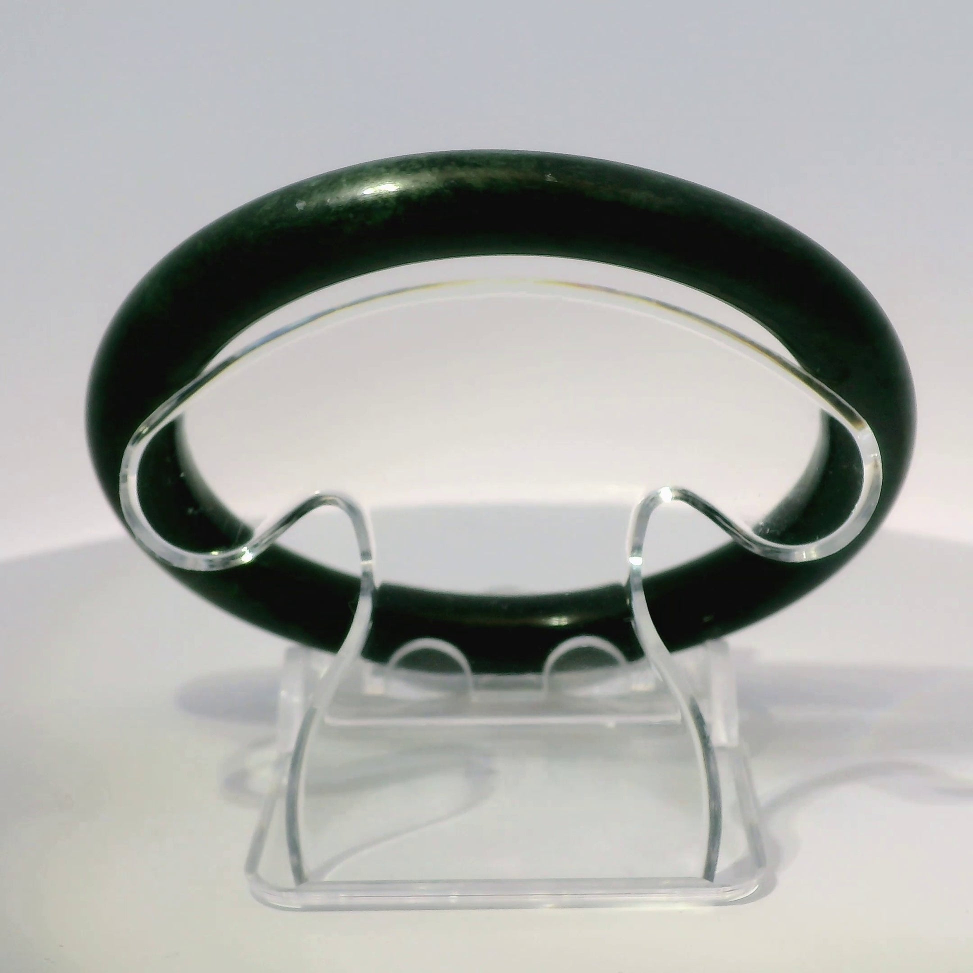 59mm Black Round Cut Jade Bangle, top-down view on display stand, authentic Type A Burma jadeite, Brother Ryan Shop