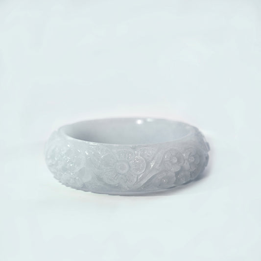61mm White Flower Carved Jade Bangle, front view on display stand, authentic Type A Burma jadeite, Brother Ryan Shop