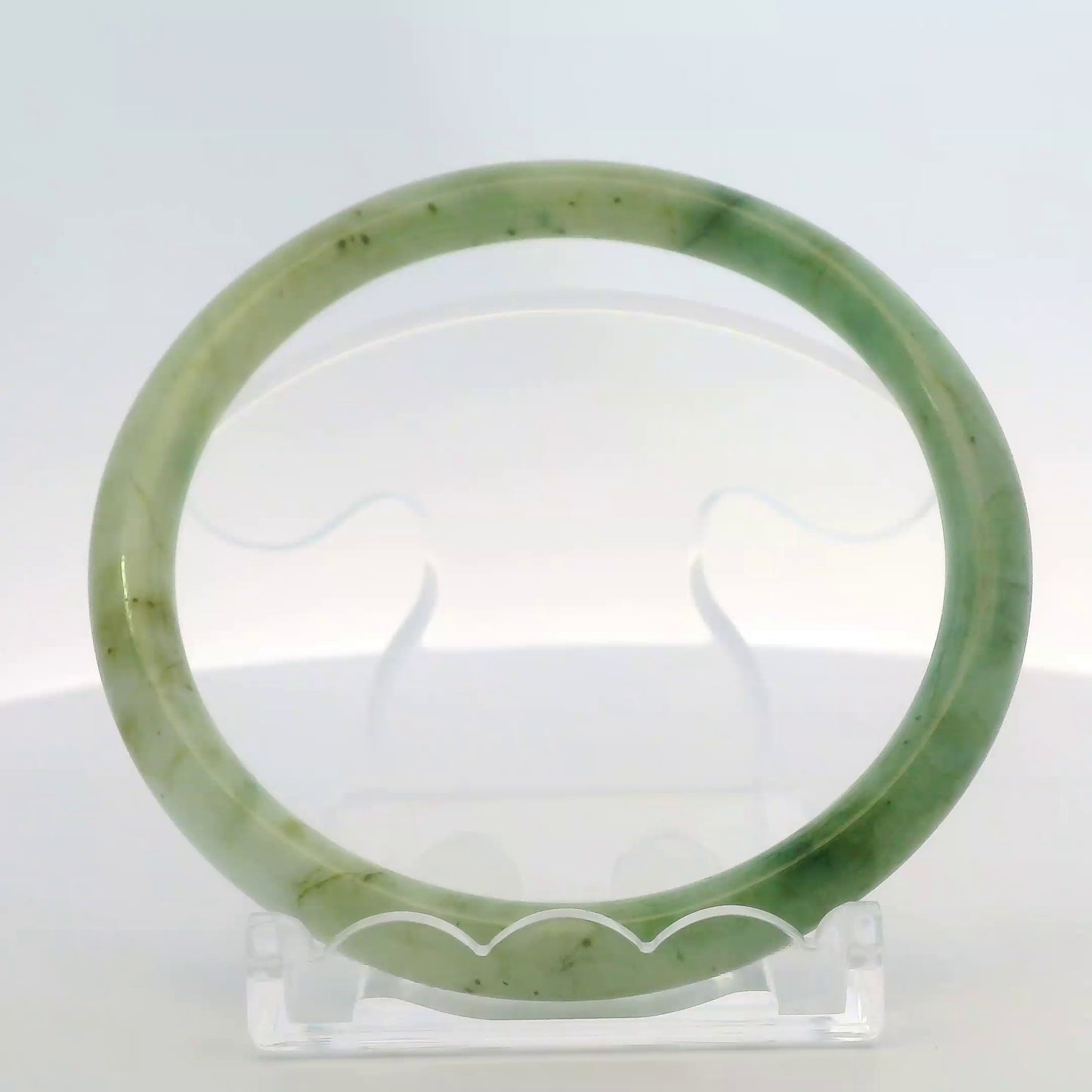 61mm Banana Leaf Round Jade Bangle, front view on display stand, authentic Type A Burma jadeite, Brother Ryan Shop