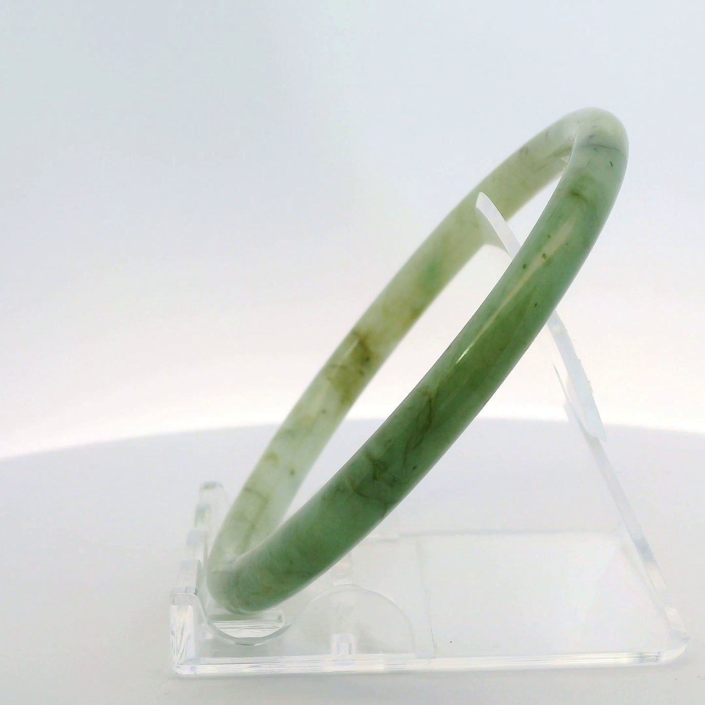 61mm Banana Leaf Round Jade Bangle, side profile view on display stand, authentic Type A Burma jadeite, Brother Ryan Shop