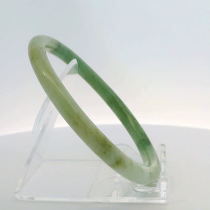 61mm Banana Leaf Round Jade Bangle, angled side view on display stand, authentic Type A Burma jadeite, Brother Ryan Shop
