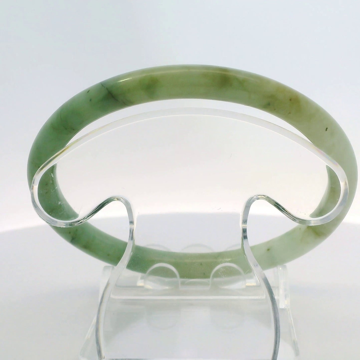 61mm Banana Leaf Round Jade Bangle, top down view on display stand, authentic Type A Burma jadeite, Brother Ryan Shop