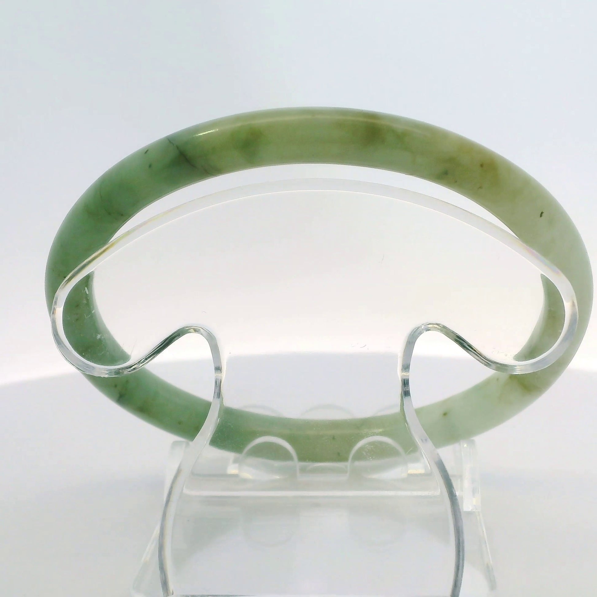 61mm Banana Leaf Round Jade Bangle, top down view on display stand, authentic Type A Burma jadeite, Brother Ryan Shop