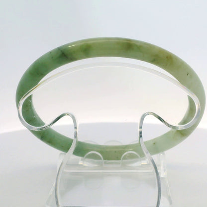 61mm Banana Leaf Round Jade Bangle, top down view on display stand, authentic Type A Burma jadeite, Brother Ryan Shop
