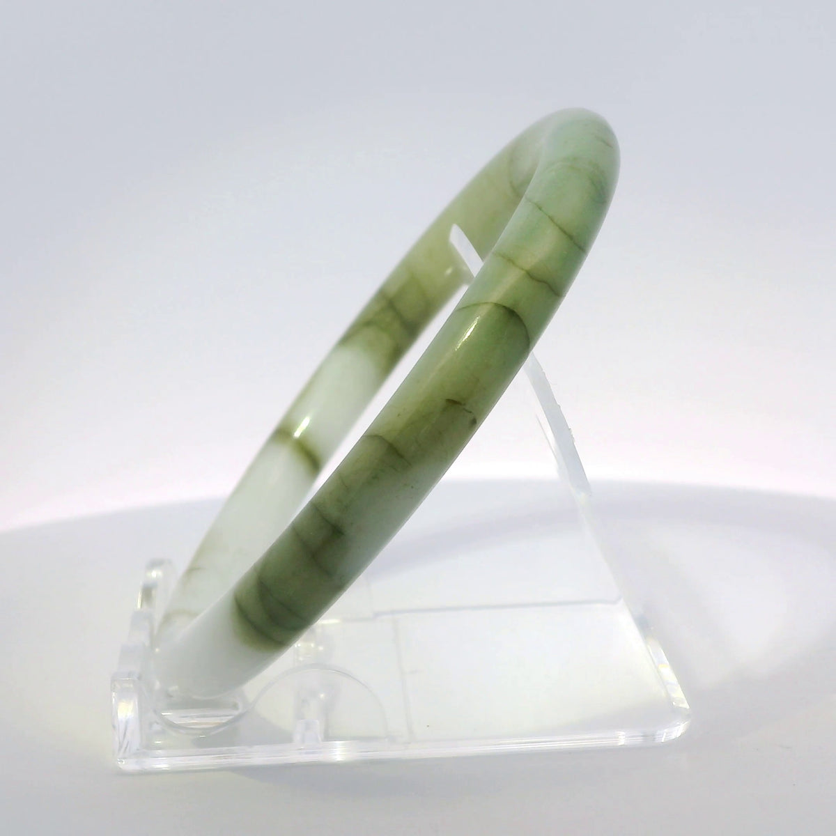 59mm White Banana Leaf Round Jade Bangle, side profile view on display stand, authentic Type A Burma jadeite, Brother Ryan Shop