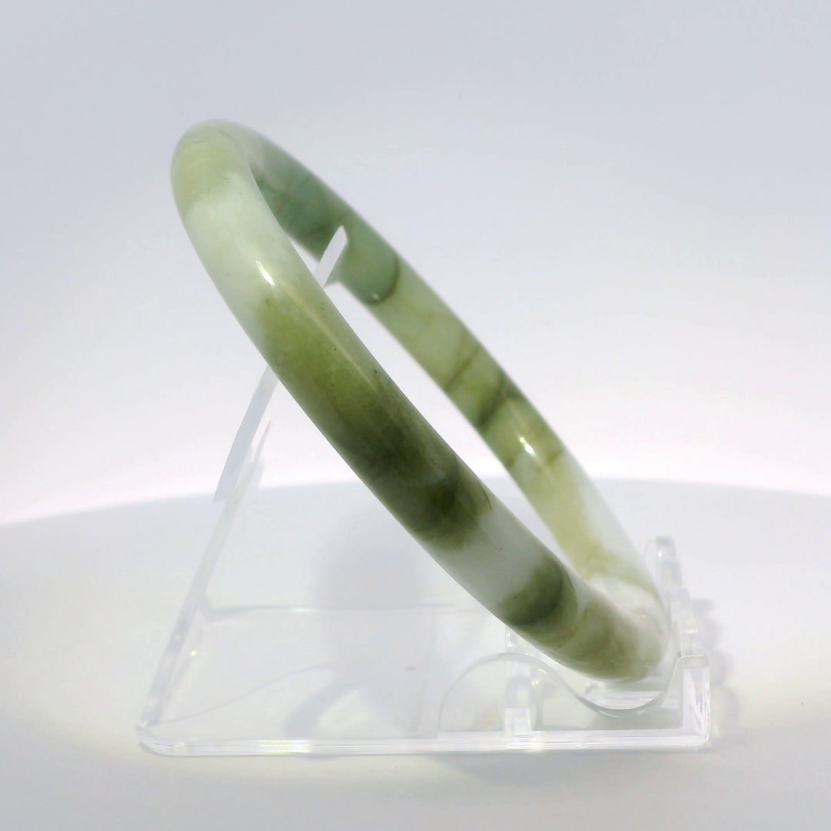 59mm White Banana Leaf Round Jade Bangle, angled side view on display stand, authentic Type A Burma jadeite, Brother Ryan Shop